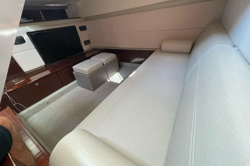 Beach House Yacht Photos Pics Luxurious interior of 2010 Sea Ray 450 Sundancer with plush seating and entertainment area.