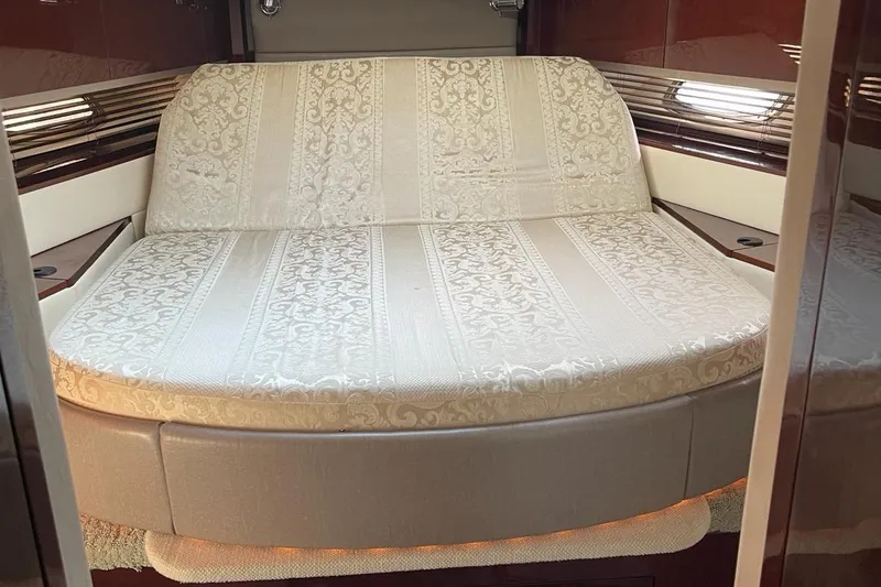 Beach House Yacht Photos Pics Luxurious cabin interior of 2010 Sea Ray 450 Sundancer yacht with elegant bedding.