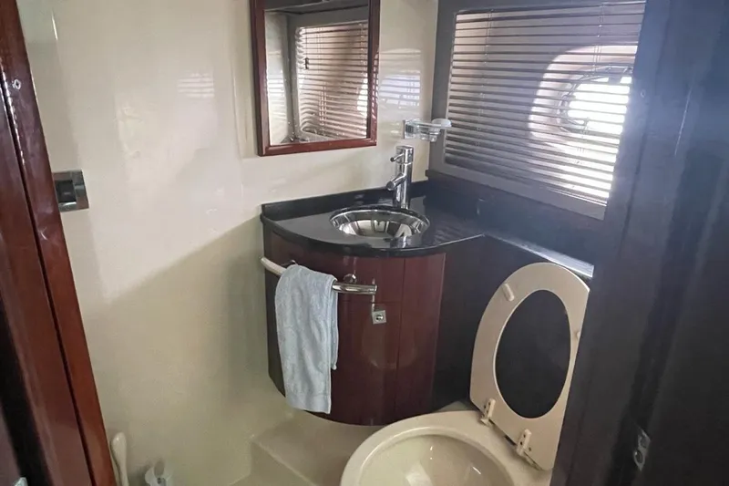 Beach House Yacht Photos Pics Luxurious bathroom in 2010 Sea Ray 450 Sundancer yacht with modern fixtures.