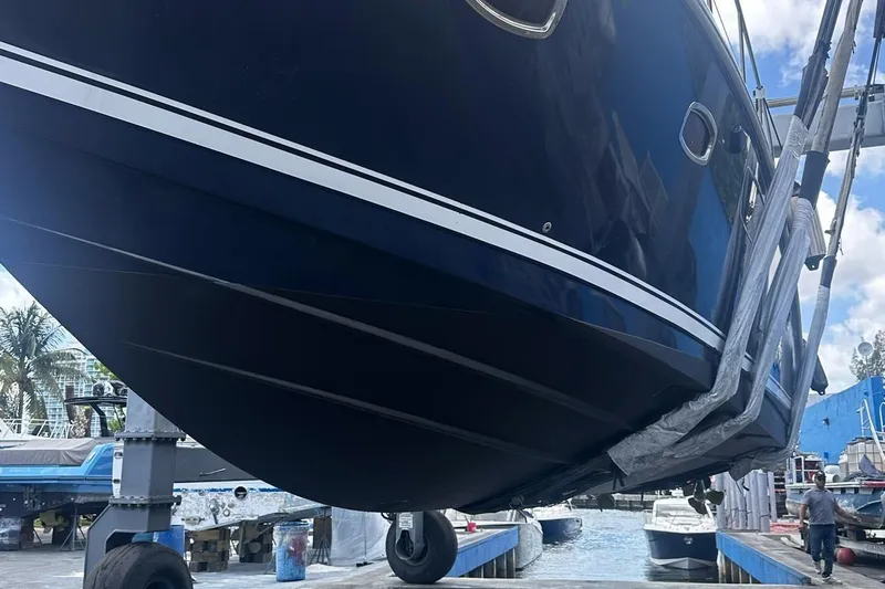 Beach House Yacht Photos Pics 2010 Sea Ray 450 Sundancer yacht in dry dock, showcasing sleek hull design.