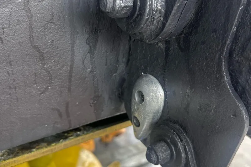 Beach House Yacht Photos Pics Close-up of a 2010 Sea Ray 450 Sundancer boat component with bolts and metal surface.