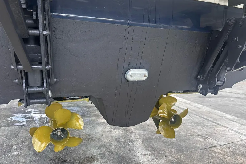 Beach House Yacht Photos Pics Close-up of 2010 Sea Ray 450 Sundancer boat propellers on dry dock.