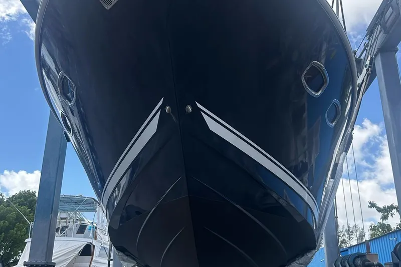 Beach House Yacht Photos Pics 2010 Sea Ray 450 Sundancer yacht in dry dock, viewed from below.