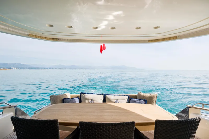 Crazy Diamond Yacht Photos Pics Monte Carlo Yachts MCY 70 2016 aft deck with ocean view and dining area.