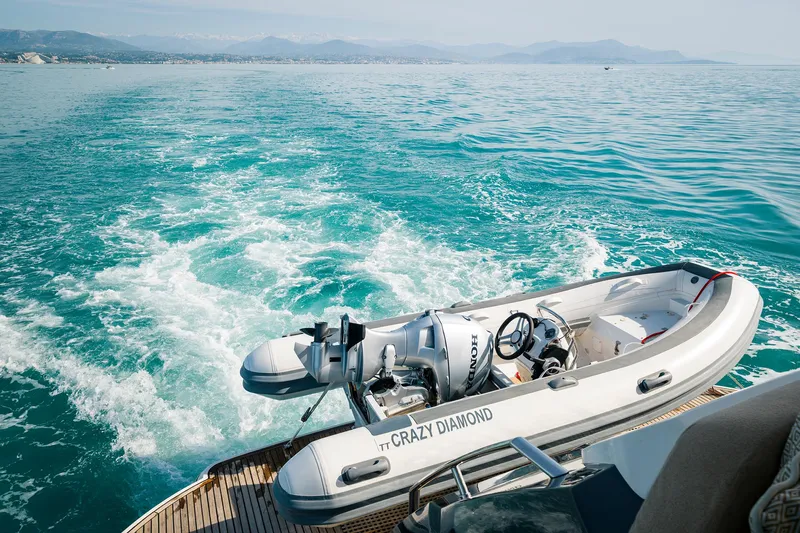 Crazy Diamond Yacht Photos Pics Monte Carlo Yachts MCY 70 2016 with tender boat Crazy Diamond on turquoise waters.