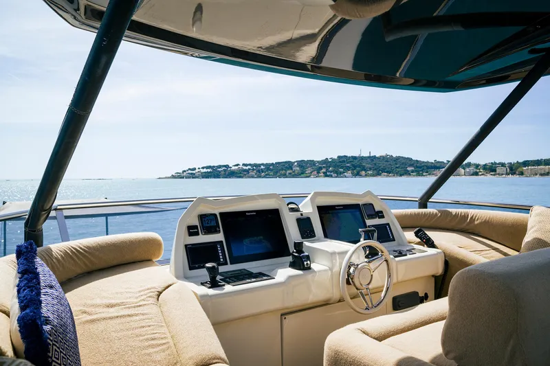 Crazy Diamond Yacht Photos Pics Cockpit view of 2016 Monte Carlo Yachts MCY 70 with scenic ocean backdrop.
