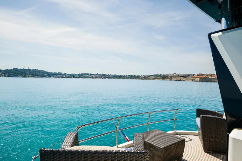 Crazy Diamond Yacht Photos Pics View from the deck of a 2016 Monte Carlo Yachts MCY 70, overlooking serene blue waters.