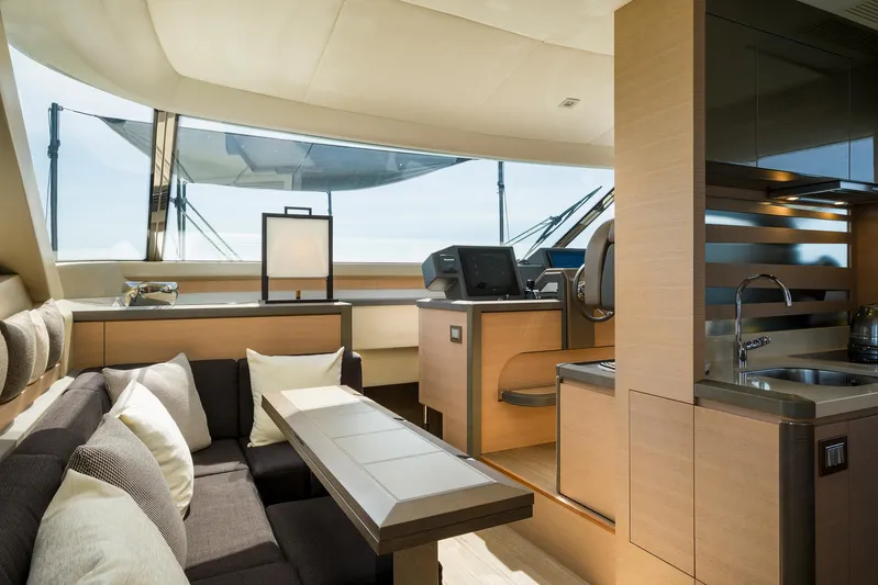 Crazy Diamond Yacht Photos Pics Luxurious interior of 2016 Monte Carlo Yachts MCY 70 with modern furnishings and panoramic windows.