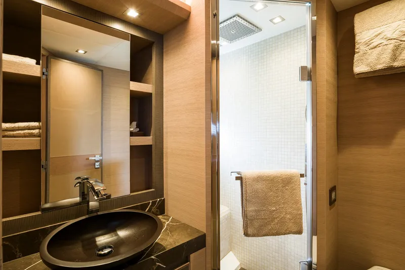 Crazy Diamond Yacht Photos Pics Luxurious bathroom in 2016 Monte Carlo Yachts MCY 70 with modern fixtures and shower.