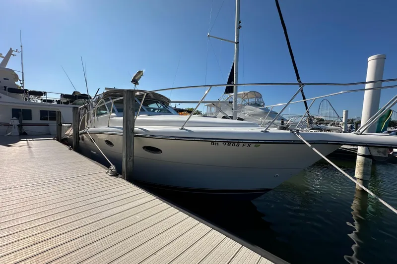  Yacht Photos Pics 2001 Tiara Yachts 3500 Open docked at marina under clear blue sky.