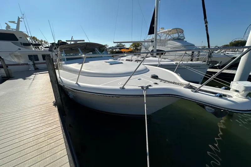  Yacht Photos Pics 2001 Tiara Yachts 3500 Open docked at marina under clear blue sky.