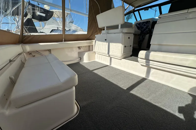  Yacht Photos Pics 2001 Tiara Yachts 3500 Open interior with seating and carpeted floor.