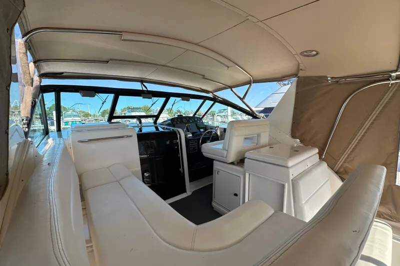  Yacht Photos Pics 2001 Tiara Yachts 3500 Open interior with white seating and helm station.