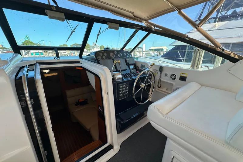  Yacht Photos Pics 2001 Tiara Yachts 3500 Open cockpit with steering wheel, controls, and cabin entrance.