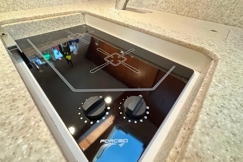  Yacht Photos Pics Electric stove in 2001 Tiara Yachts 3500 Open, featuring dual burners and sleek design.