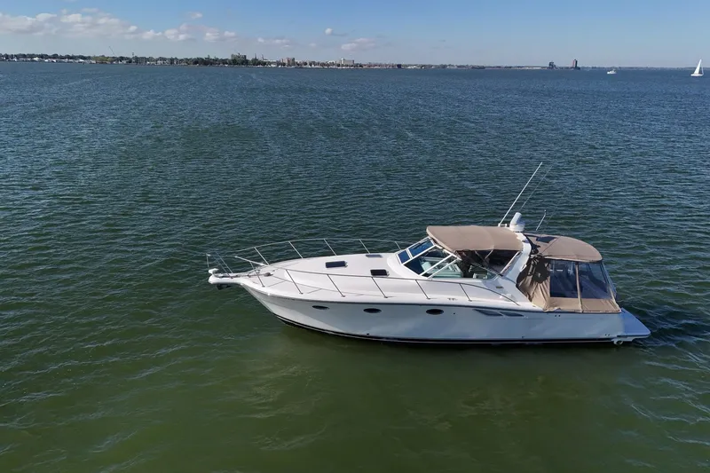  Yacht Photos Pics 2001 Tiara Yachts 3500 Open cruising on calm waters under a clear sky.