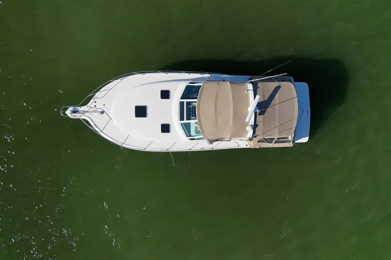  Yacht Photos Pics Aerial view of 2001 Tiara Yachts 3500 Open on calm green water.