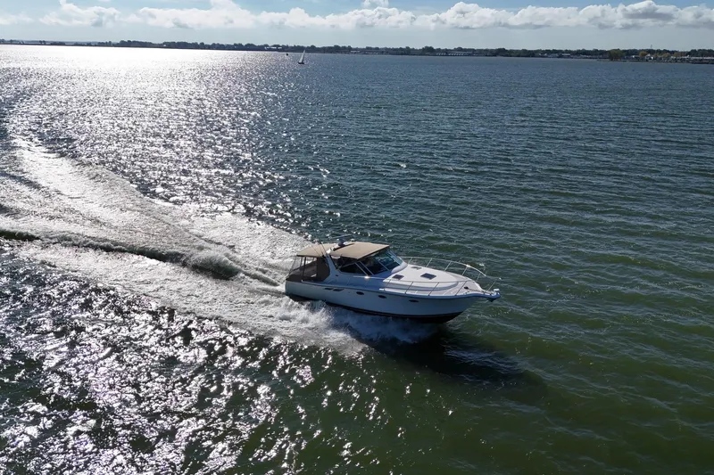  Yacht Photos Pics 2001 Tiara Yachts 3500 Open cruising on a sunny, sparkling sea.