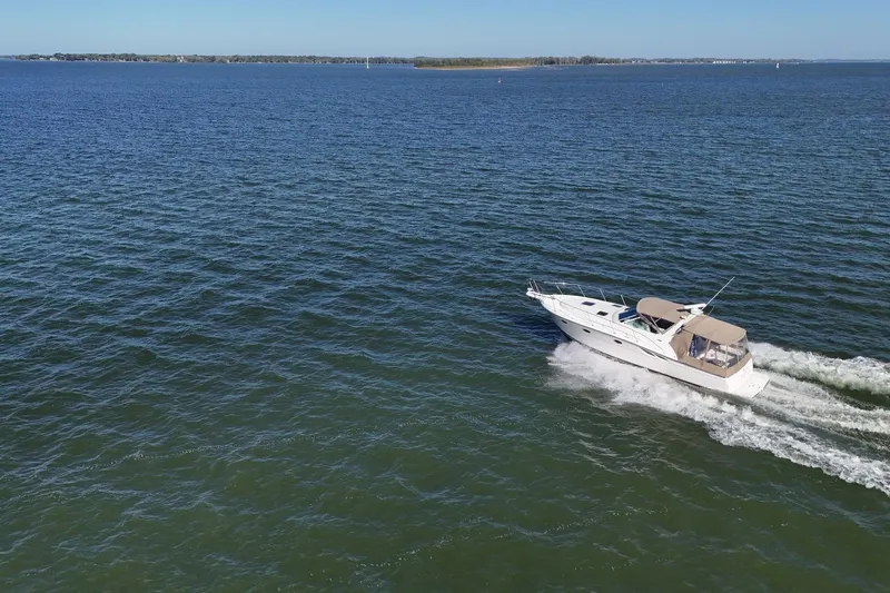  Yacht Photos Pics A 2001 Tiara Yachts 3500 Open cruising on a vast, serene blue ocean.