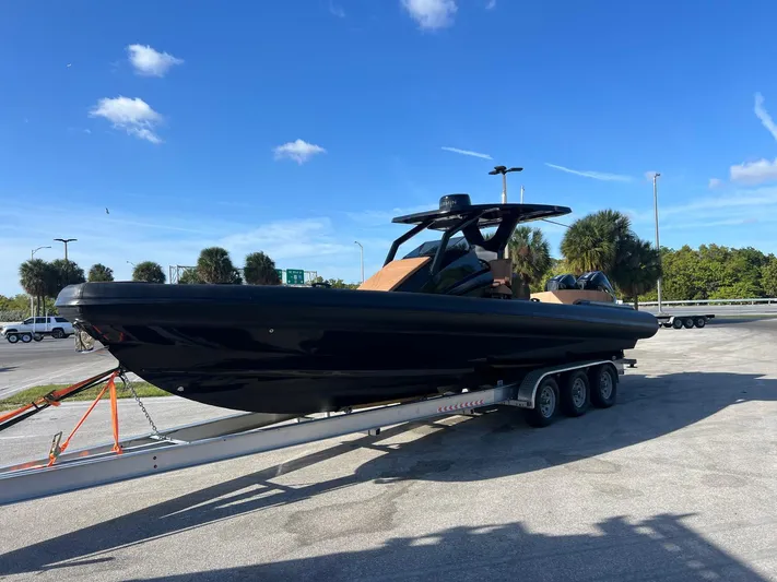 Novielli Yacht Photos Pics 2026 Novielli Veloche 349 boat on trailer under clear blue sky.