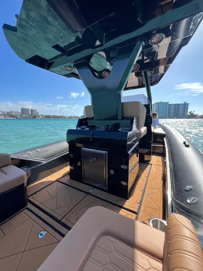 Novielli Yacht Photos Pics Luxury Novielli Veloche 349 boat interior, 2026 model, on clear blue water with city skyline.