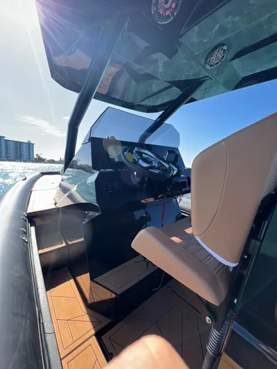 Novielli Yacht Photos Pics Interior of 2026 Novielli Veloche 349 boat with steering wheel and seating.