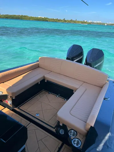 Novielli Yacht Photos Pics Luxurious Novielli Veloche 349 boat interior with tan seating, overlooking turquoise waters.