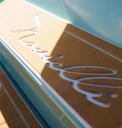 Novielli Yacht Photos Pics Close-up of Novielli Veloche 349 logo on wooden surface, 2026 model.