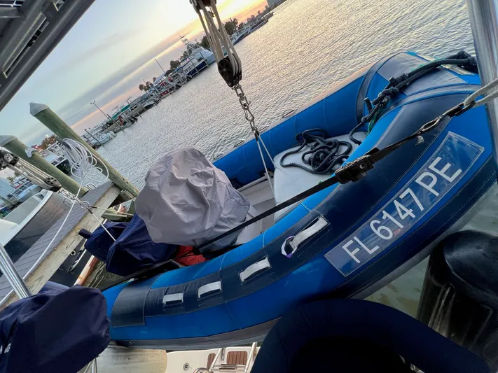 Rafel Yacht Photos Pics Inflatable boat docked, sunset in the background.