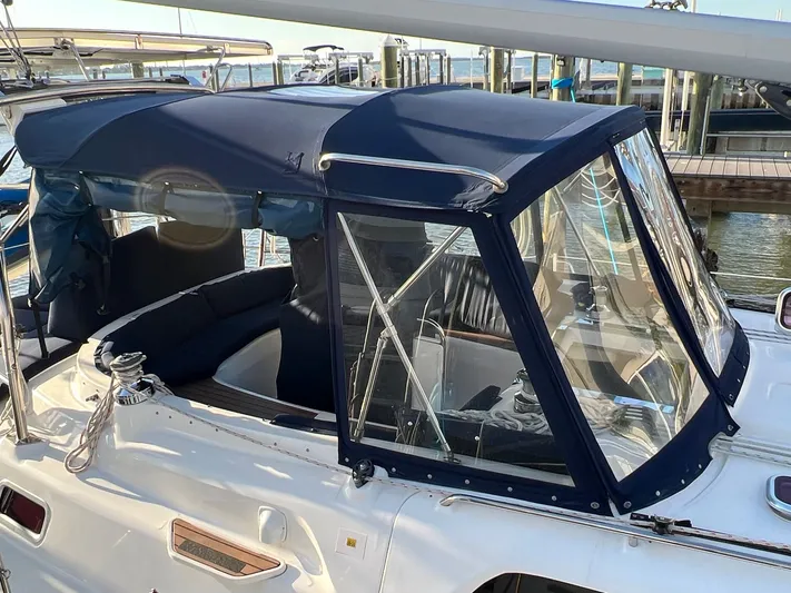 Rafel Yacht Photos Pics 2006 Hunter 45 Center Cockpit with blue cover in harbor.