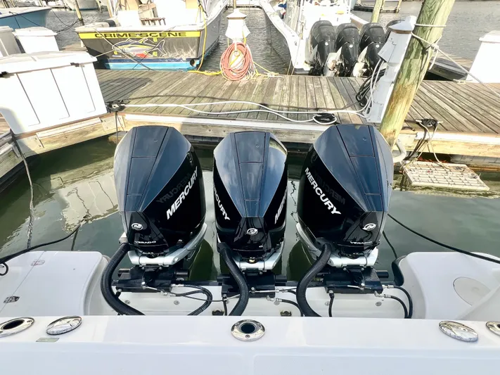  Yacht Photos Pics 2011 Boston Whaler 345 Conquest with triple Mercury outboard engines at dock.