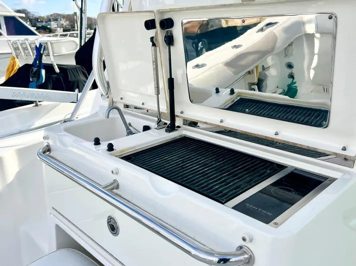  Yacht Photos Pics Boston Whaler 345 Conquest 2011 boat grill and sink setup on deck.