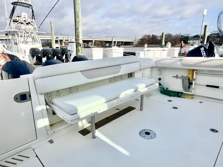  Yacht Photos Pics 2011 Boston Whaler 345 Conquest boat deck with seating and outboard motors.