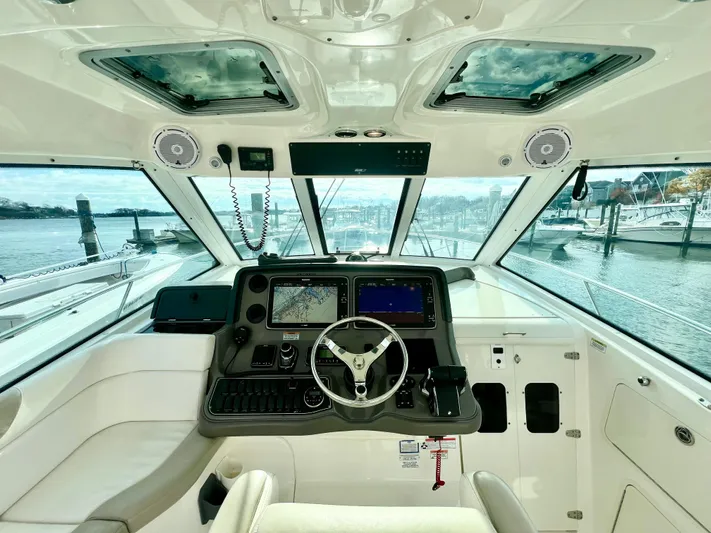  Yacht Photos Pics Interior helm of 2011 Boston Whaler 345 Conquest with navigation equipment.