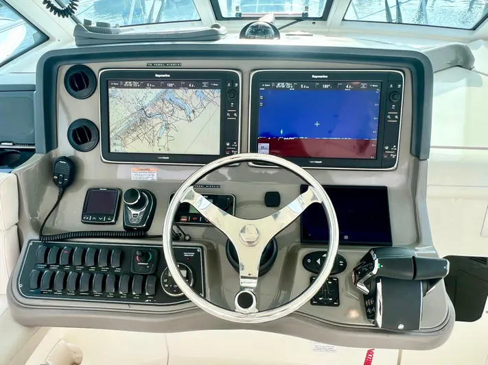  Yacht Photos Pics 2011 Boston Whaler 345 Conquest helm with dual navigation screens and controls.