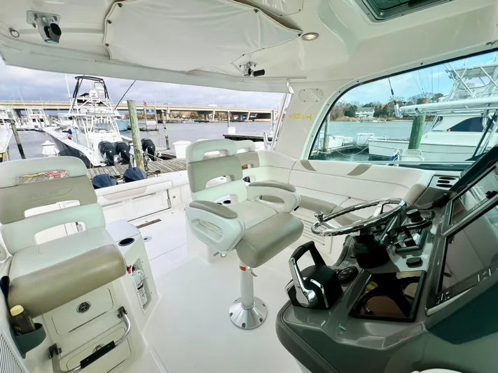  Yacht Photos Pics Interior of 2011 Boston Whaler 345 Conquest boat with helm and seating area.
