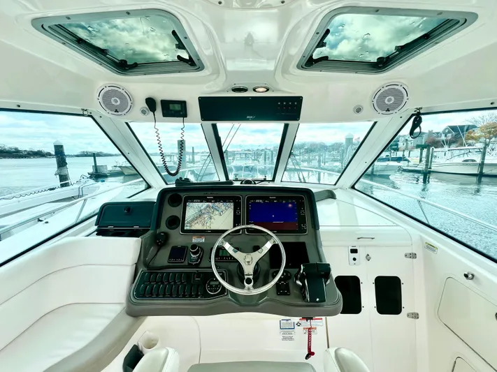  Yacht Photos Pics Interior cockpit of 2011 Boston Whaler 345 Conquest with advanced navigation system.