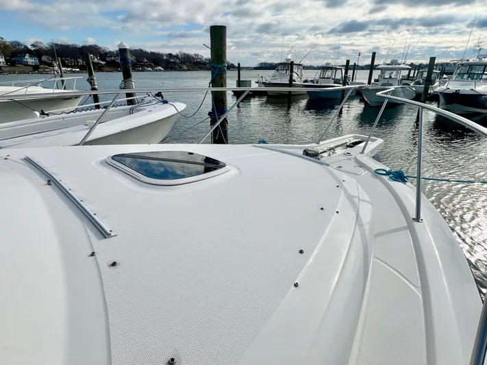 Yacht Photos Pics 2011 Boston Whaler 345 Conquest docked at marina, showcasing sleek deck design.