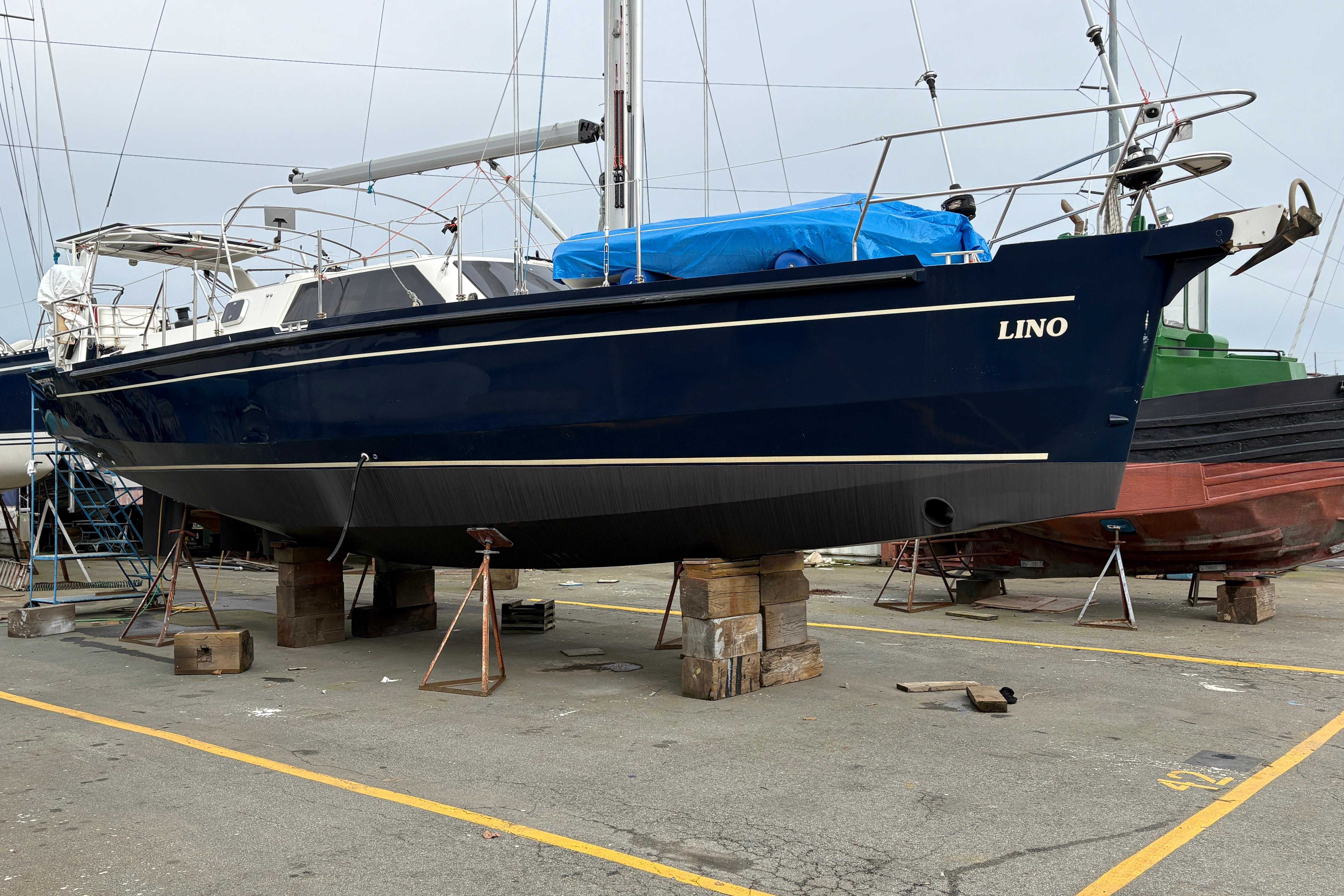2019 Chatam Extreme 42 sailboat on dry dock, blue hull, named "Lino."