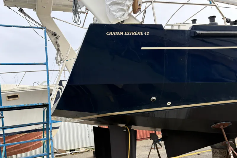 Lino Yacht Photos Pics 2019 Chatam Extreme 42 yacht in dry dock, blue hull, maintenance setup.