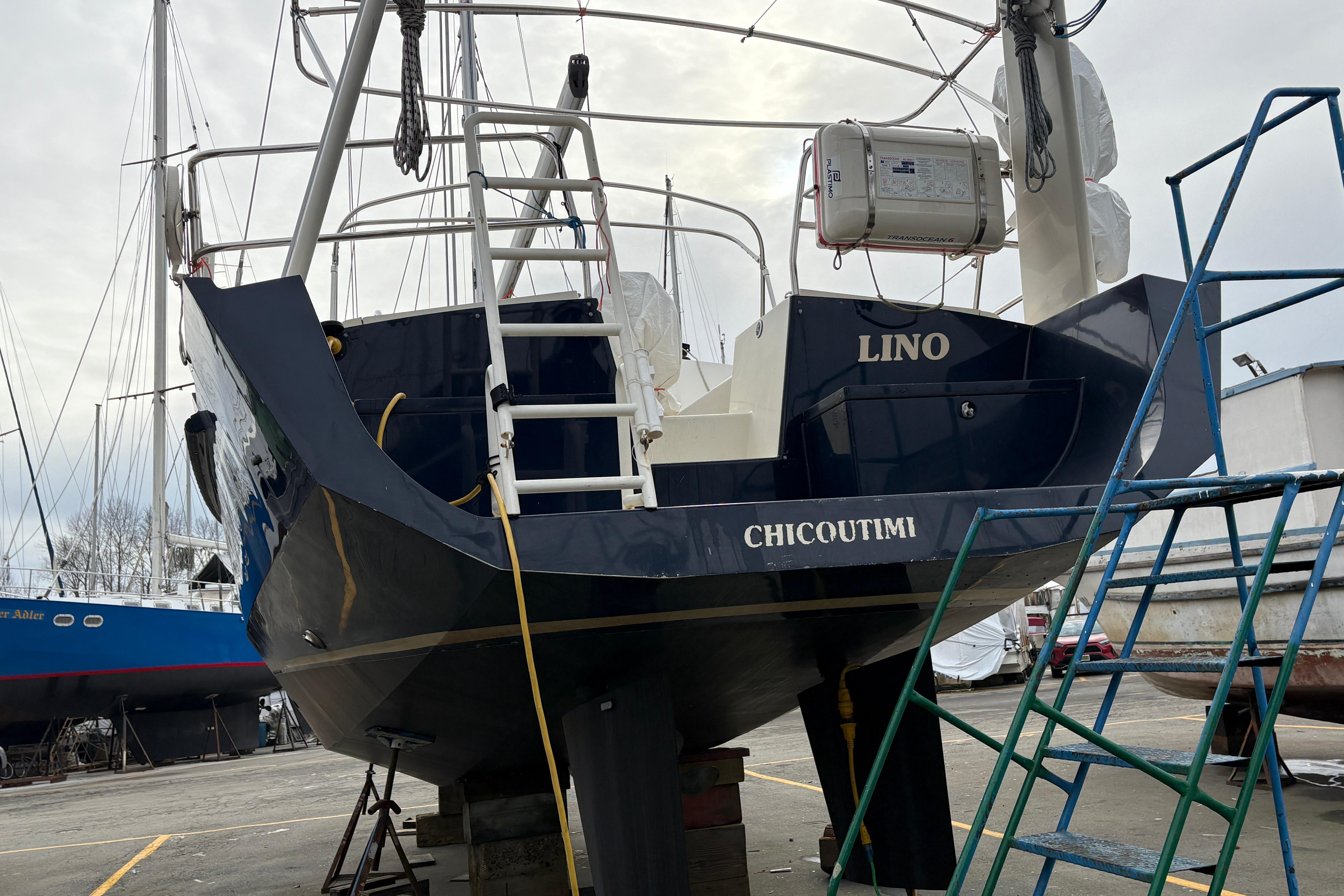 2019 Chatam Extreme 42 sailboat in dry dock, featuring a sleek navy hull.