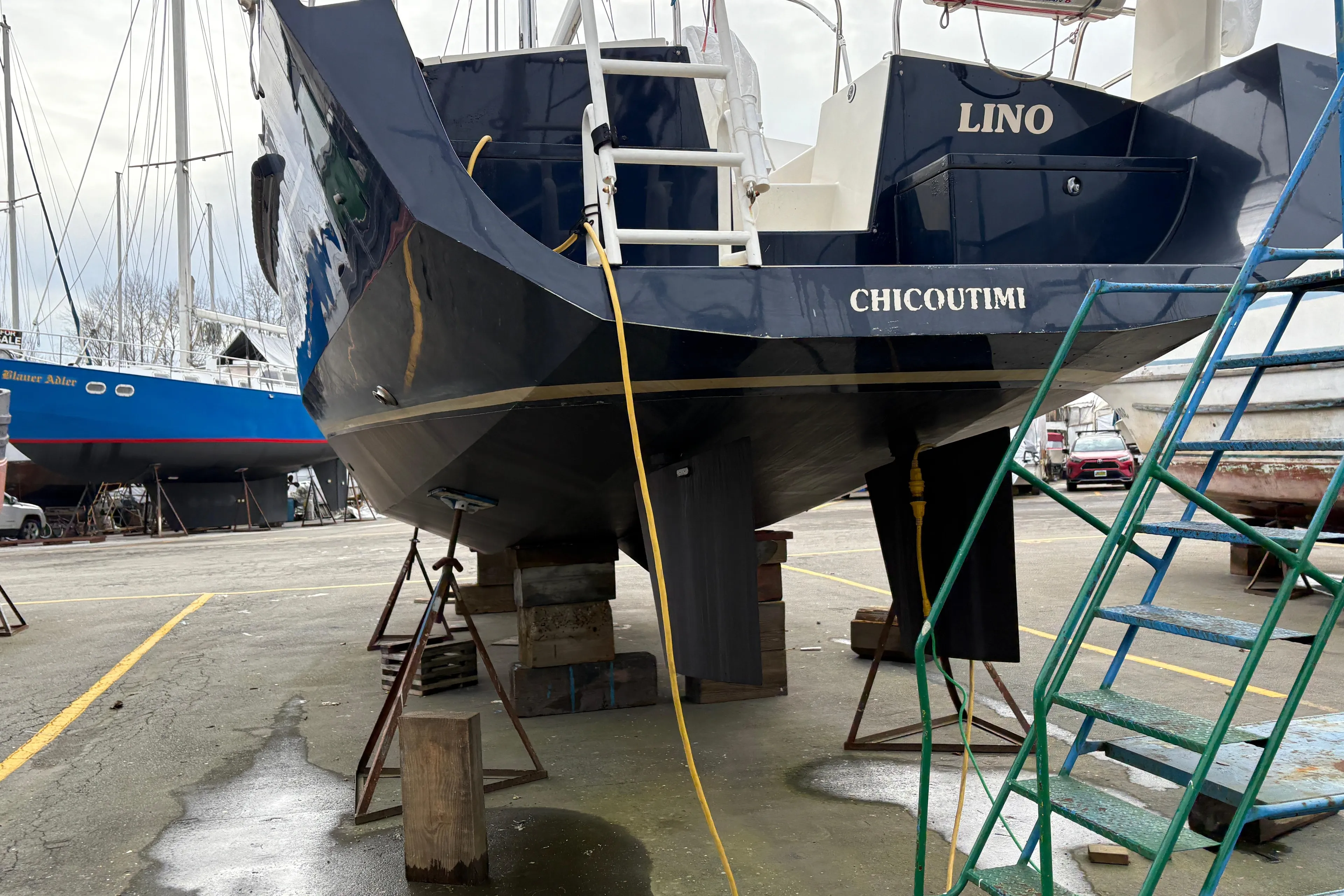 2019 Chatam Extreme 42 sailboat in dry dock, Chicoutimi, with blue hull and ladder access.