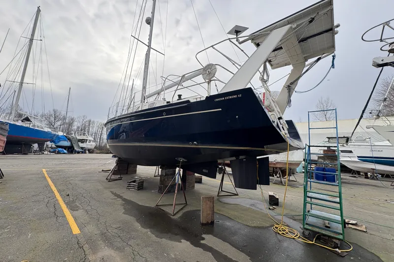 Lino Yacht Photos Pics 2019 Chatam Extreme 42 sailboat in dry dock, surrounded by other vessels.