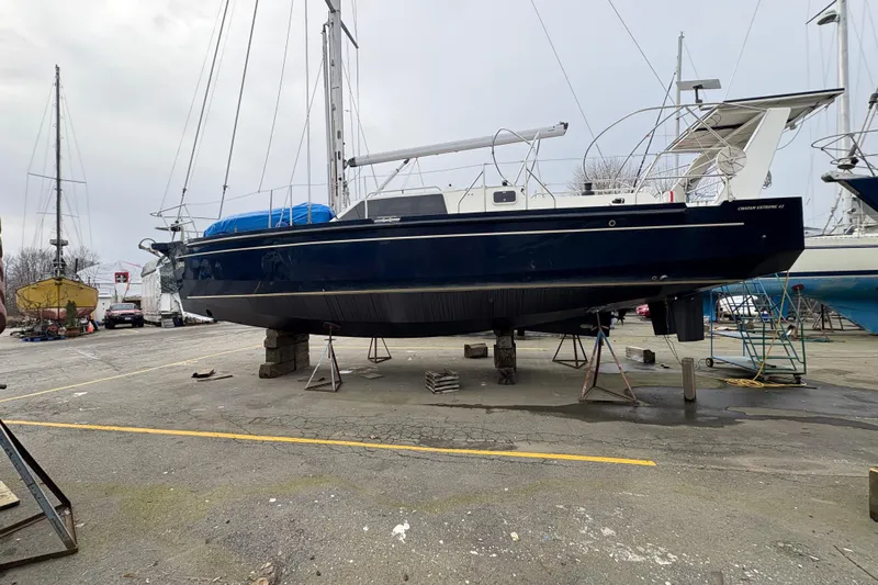 Lino Yacht Photos Pics 2019 Chatam Extreme 42 sailboat on dry dock, blue hull, marina setting.