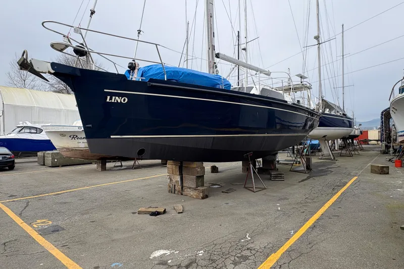 Lino Yacht Photos Pics 2019 Chatam Extreme 42 sailboat on dry dock, blue hull, marina setting.
