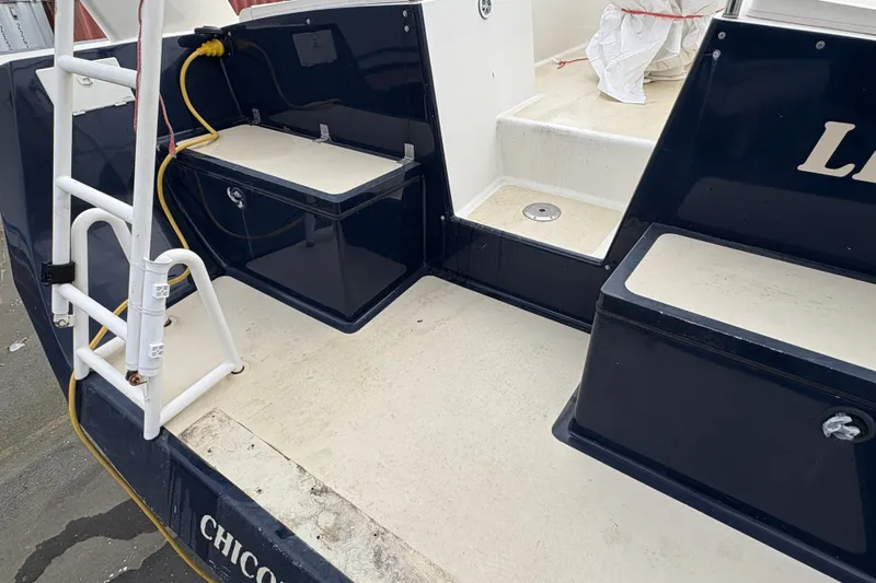 Lino Yacht Photos Pics Rear deck of 2019 Chatam Extreme 42 boat with storage compartments and ladder.