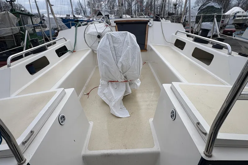 Lino Yacht Photos Pics 2019 Chatam Extreme 42 sailboat cockpit with covered wheel, docked in a marina.