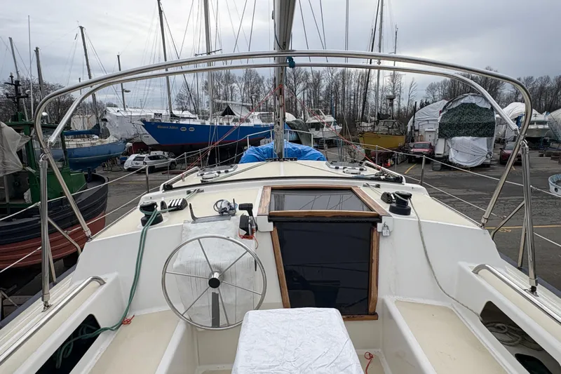Lino Yacht Photos Pics 2019 Chatam Extreme 42 sailboat in a marina, surrounded by other boats.