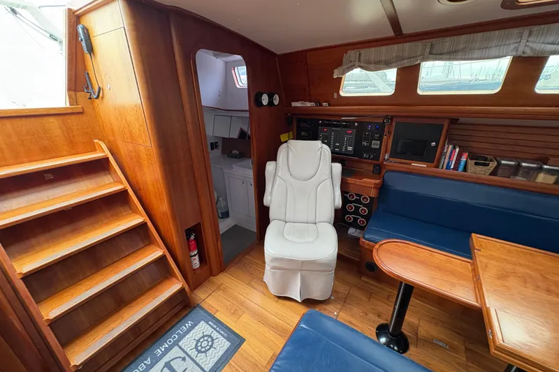Lino Yacht Photos Pics Interior of 2019 Chatam Extreme 42 yacht with wooden finish and seating area.