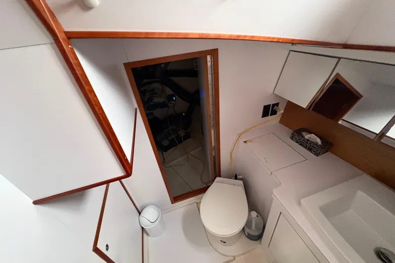 Lino Yacht Photos Pics Bathroom interior of 2019 Chatam Extreme 42 yacht with modern fixtures and wooden accents.